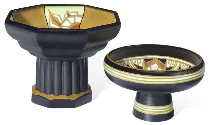 Two black geometric ceramic bowls with decorative interior patterns on white background.