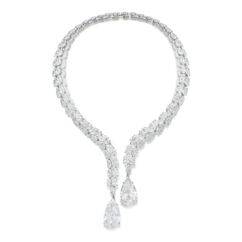 Elegant diamond necklace with teardrop pendants displayed on a white background.