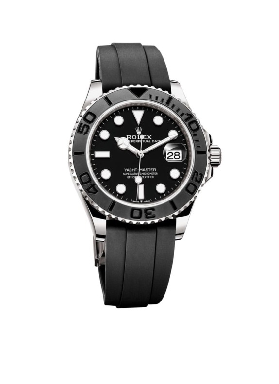 Luxury watch with a black dial and bezel on a black rubber strap displaying the time and date, styled for elegance.
