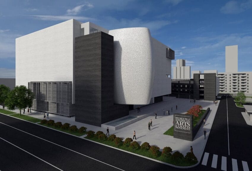 Modern architectural building with people walking, surrounded by greenery, and a sign reading "Institute of the Arts."