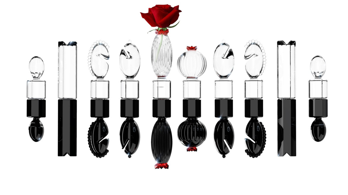 Black and clear artistic vases with rose accents arranged in a row, featuring intricate designs and elegant shapes.