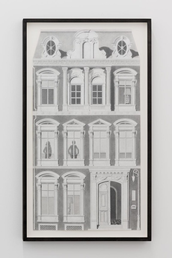 Framed black and white architectural drawing of a building facade with detailed windows and ornate roof design.