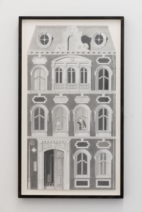 Framed artwork depicting a detailed black and white illustration of a multi-story building with decorative windows.