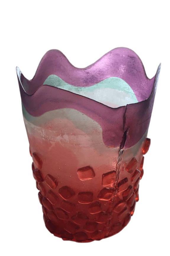 Colorful glass vase with textured base and wavy rim, featuring shades of purple, green, and red.