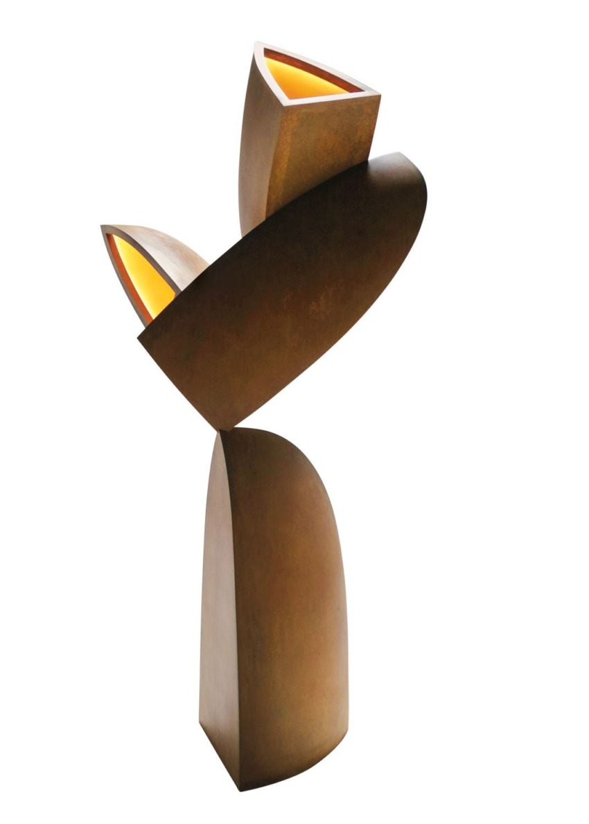 Abstract bronze sculpture with two upward-facing curved forms, featuring illuminated triangular openings at the top.