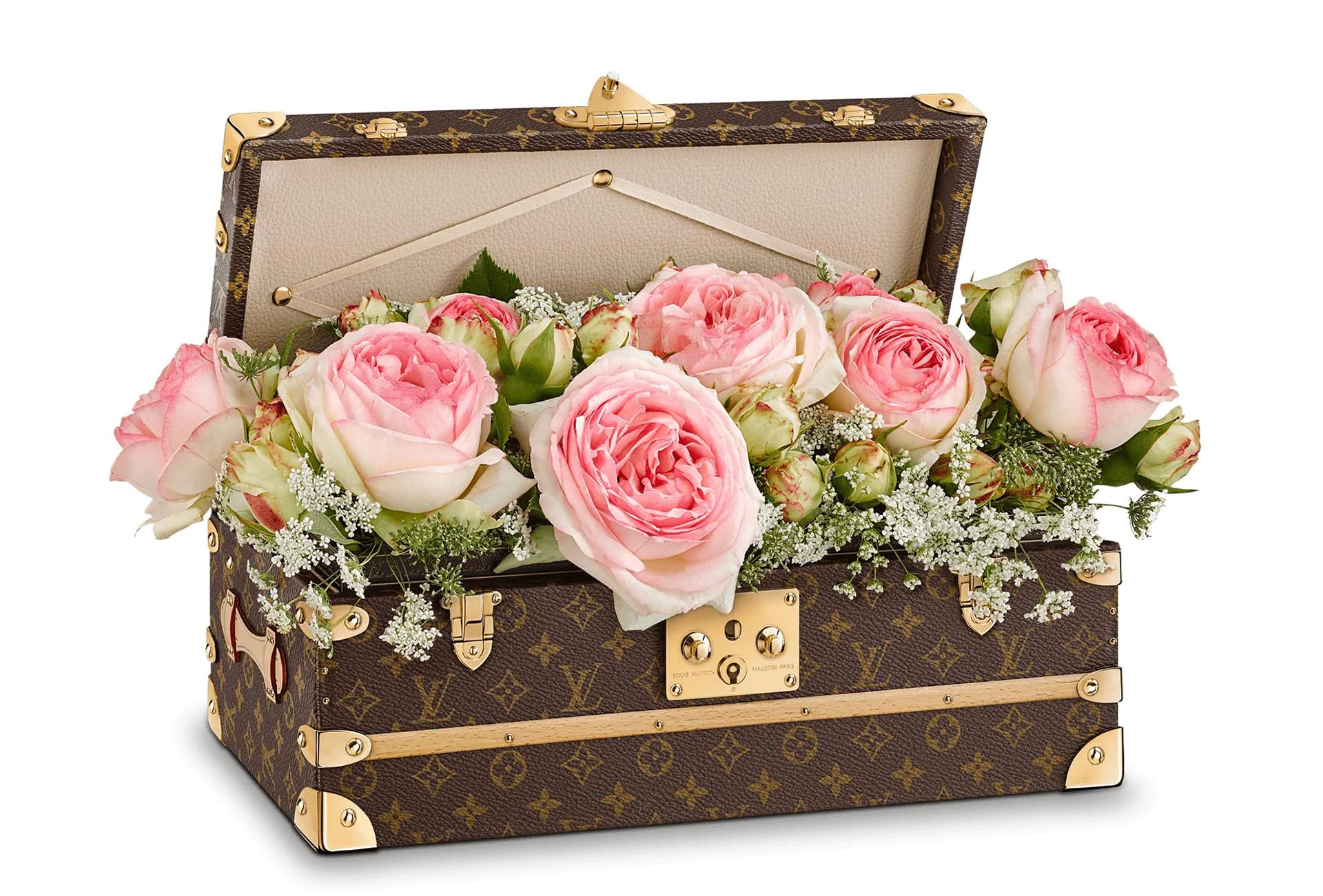 Open decorative brown and gold box filled with pink roses and delicate greenery, arranged beautifully.