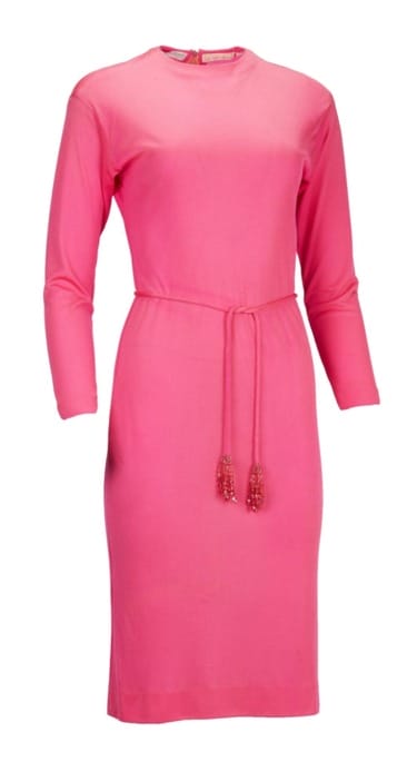 Pink long-sleeve dress with a matching belt and tassels, suitable for casual or semi-formal occasions.