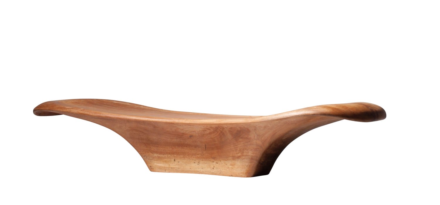 Wooden sculptural bench with smooth, flowing design and natural finish.
