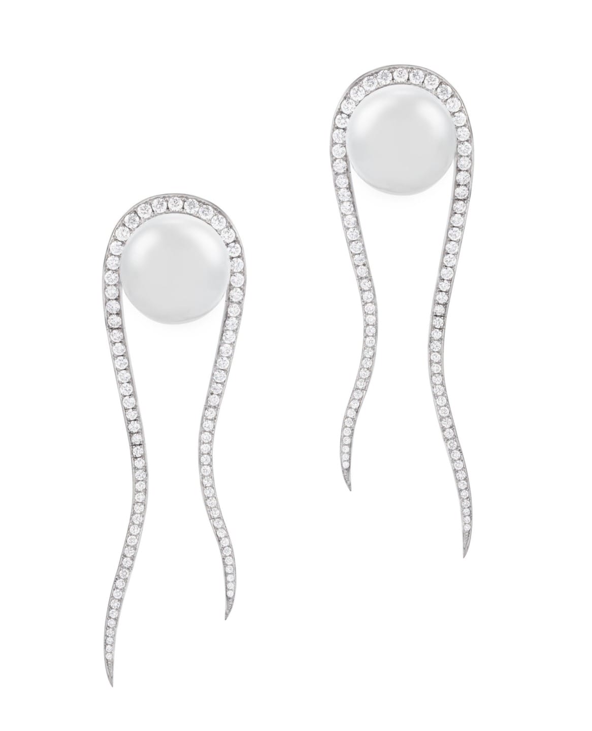 Elegant pearl earrings with long, curved diamond-encrusted design on a white background.
