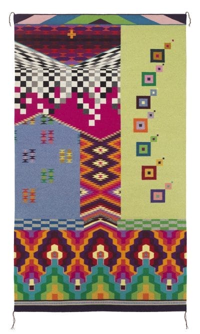 Colorful geometric-patterned tapestry with squares, zigzags, and bold colors on a vertical rectangular layout.