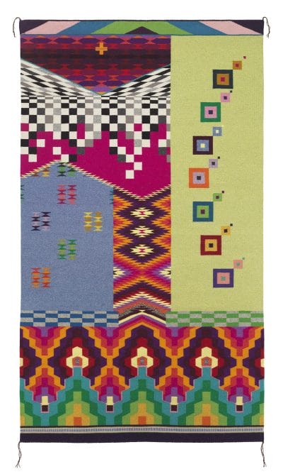 Colorful geometric-patterned tapestry with squares, zigzags, and bold colors on a vertical rectangular layout.