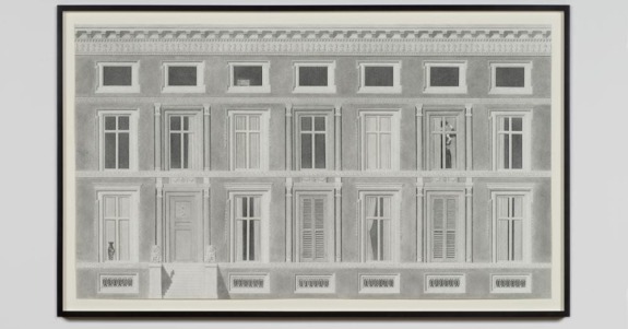 Black and white drawing of a classic building facade with detailed windows and an open door in a framed display.