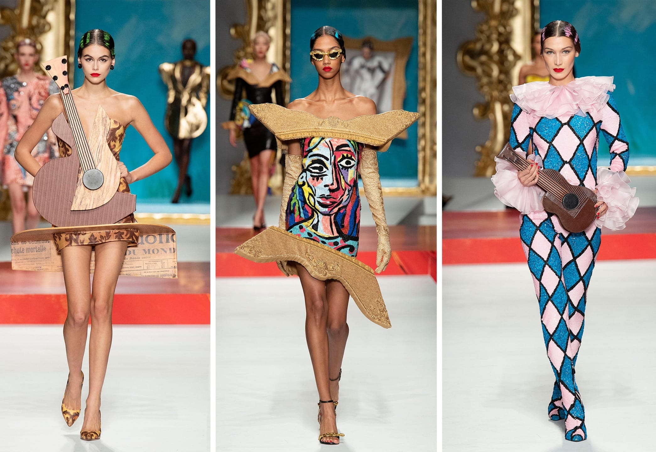 Three models on a runway wearing artistic and colorful outfits, one with a guitar, one with abstract patterns, and one with a harp.