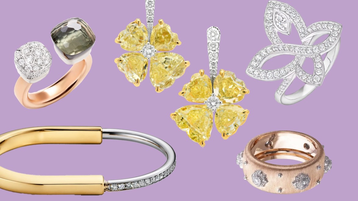 A collection of elegant jewelry including rings, earrings, and bracelets on a purple background.
