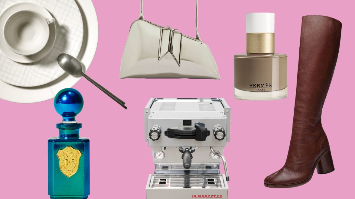 Collection of luxury items including a coffee cup, handbag, perfume, knee-high boot, espresso machine, and blue bottle on pink background.