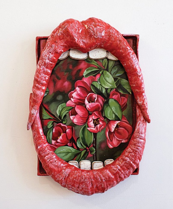 Artwork featuring a wide open red mouth with a painting of vibrant red flowers inside, expressing a mix of nature and surrealism.