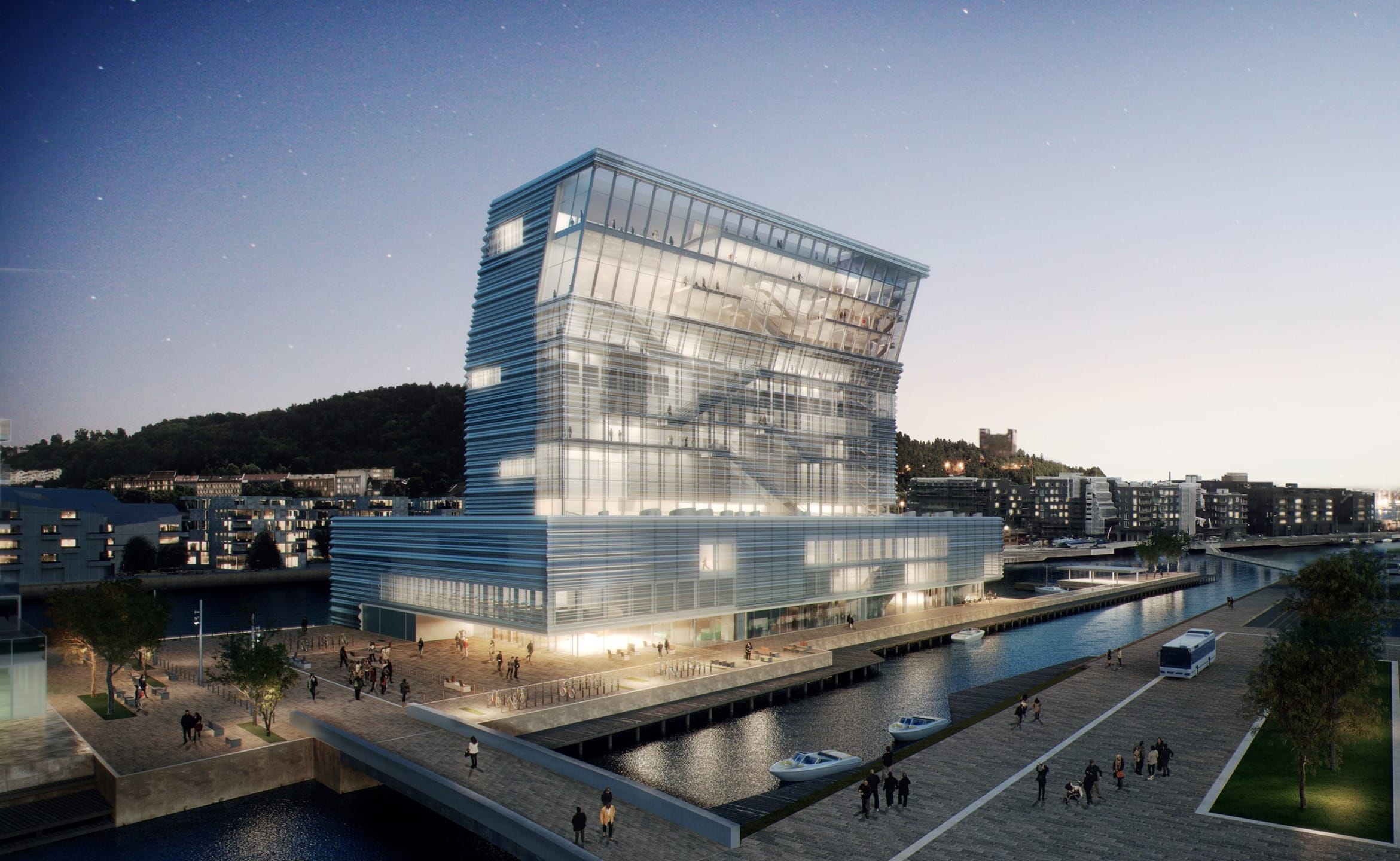 Modern waterfront building with large glass windows, surrounded by a canal and city lights at dusk.