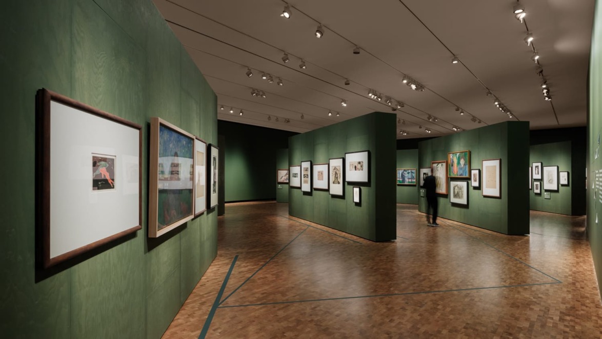 art gallery with green walls displaying framed artworks and a visitor observing the exhibits