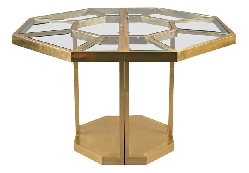 Glass-top octagonal table with a geometric gold frame and base, featuring reflective triangular sections on the surface.