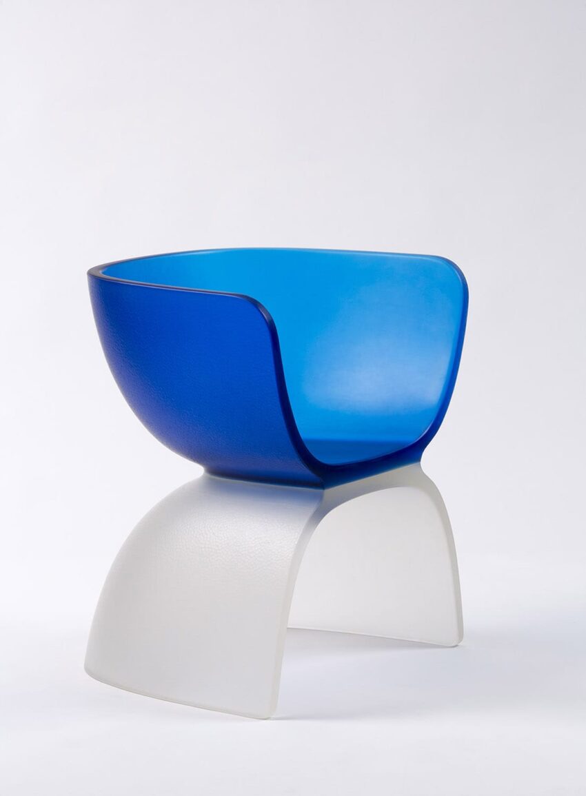 Modern blue and white two-piece chair with a sleek, curved design on a plain white background.