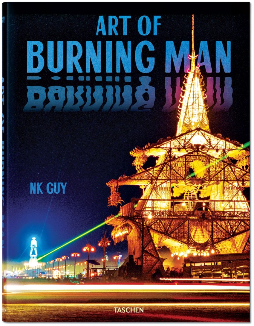 Cover of "Art of Burning Man" showing an illuminated art structure at night with a vibrant light display.