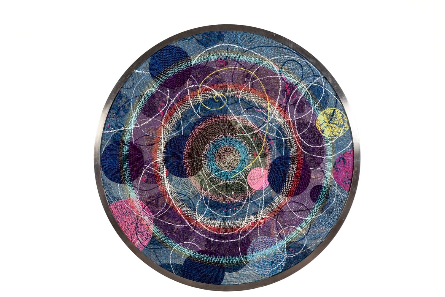 Circular abstract artwork featuring layered colorful patterns and swirling lines, creating a dynamic and vibrant visual effect.