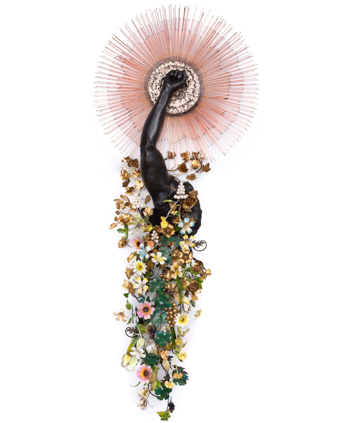 Sculpture with raised arm, halo of spikes, and cascading flowers and foliage on a white background.