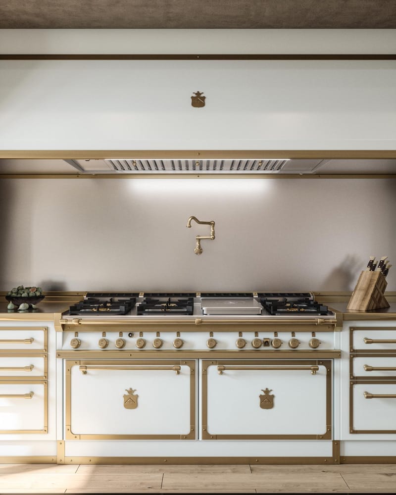 Luxurious kitchen with a vintage-style cream and gold stove, featuring brass details and a pot filler faucet above.