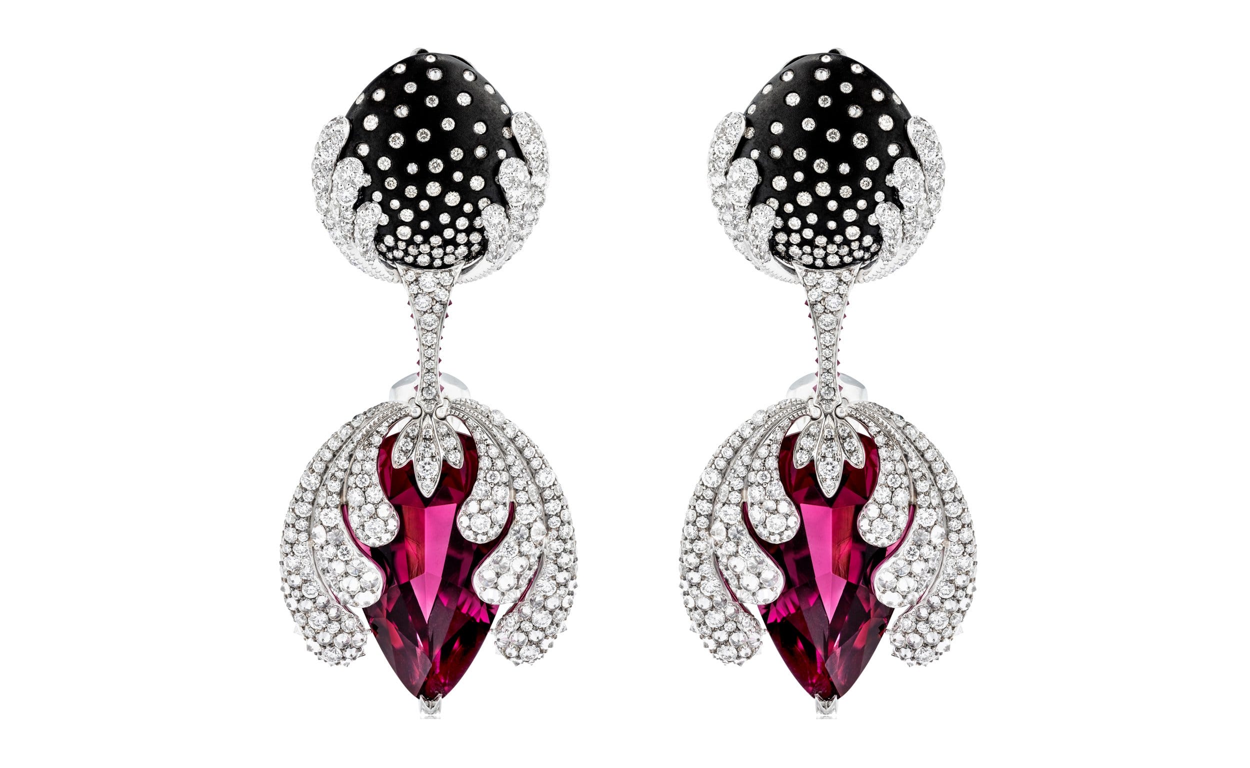 Elegant black and silver diamond earrings with red gemstones and intricate detailing on a white background.