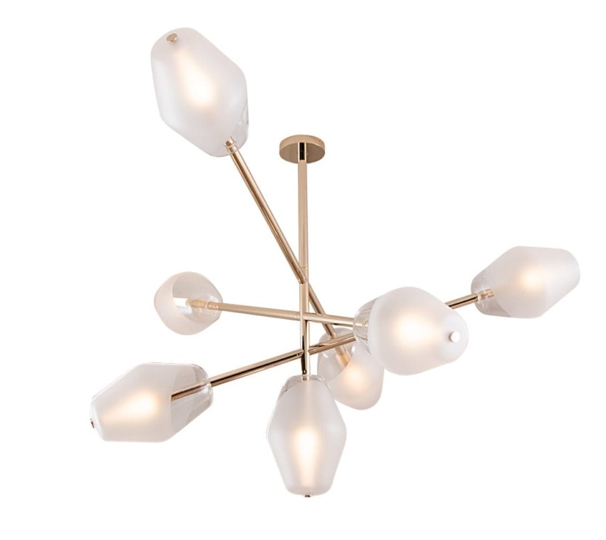 Modern gold chandelier with six frosted glass bulb covers in a starburst arrangement against a white background.