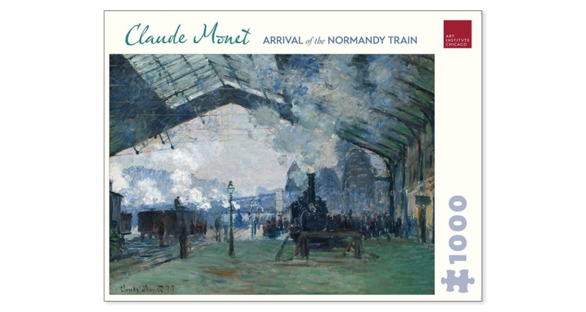 Puzzle box featuring Claude Monet's painting "Arrival of the Normandy Train" displayed at the Art Institute of Chicago.