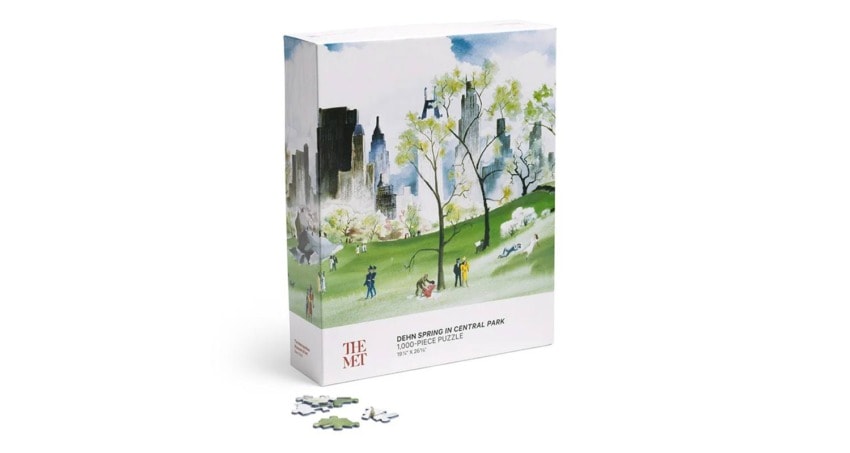 Puzzle box featuring a spring scene in Central Park with diverse figures and a city skyline in the background.