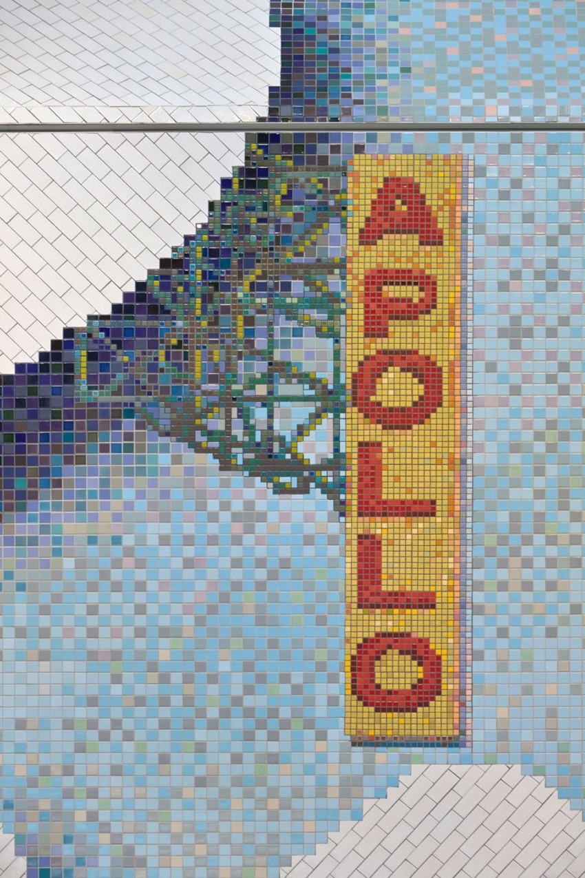 Colorful mosaic artwork featuring the word "APOLLO" in large red letters against a blue-tiled background.