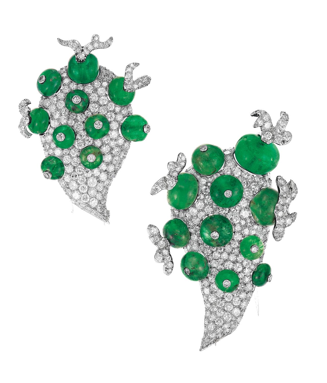 Silver and green gemstone earrings with intricate leaf and vine design on a white background.