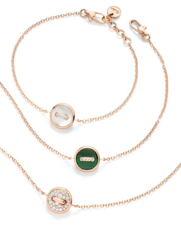 Three gold chain bracelets with round gemstone pendants in green, white, and diamond embellishments on a white background.