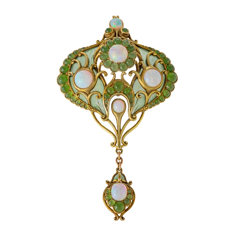 Art Nouveau-style brooch with opals and green gemstones, featuring intricate floral motifs and elegant gold detailing.