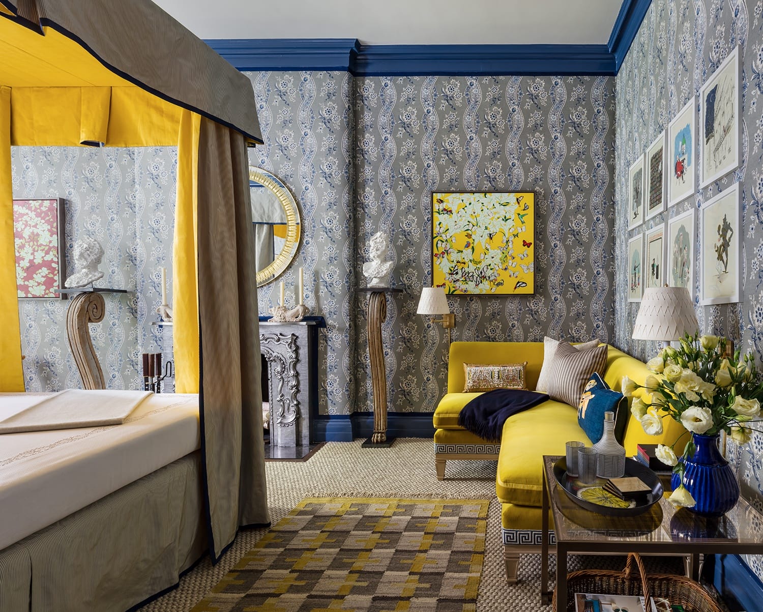 Elegant room with yellow and blue accents, featuring a yellow sofa, patterned wallpaper, and stylish decor elements.