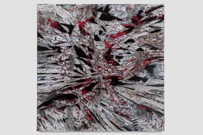 Abstract painting with red, black, and white streaks creating a dynamic, chaotic pattern on the canvas.
