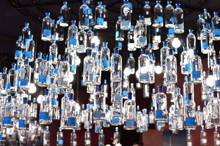 The bottle chandelier inside the Casa Dragones “Quiote Bar."