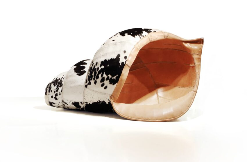 Cowhide leather chair shaped like a beanbag with black and white patterns on a white background.