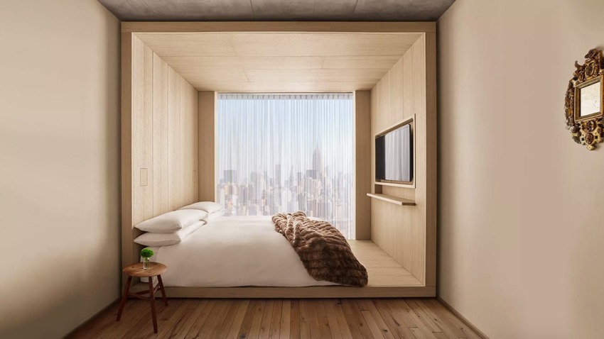 Modern minimalist bedroom with a wooden cube design, city skyline view, and a cozy bed with a fur throw blanket.