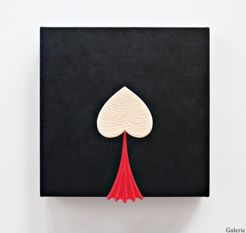 Abstract artwork featuring a white textured spade shape on a black canvas with a red tail draping below.