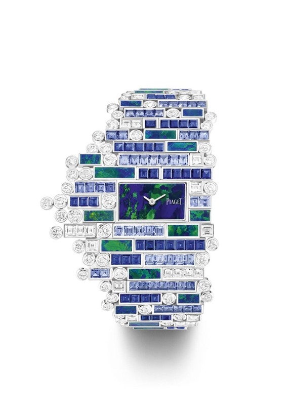 Luxurious jeweled wristwatch with a blue and green gemstone design, surrounded by sparkling diamonds.