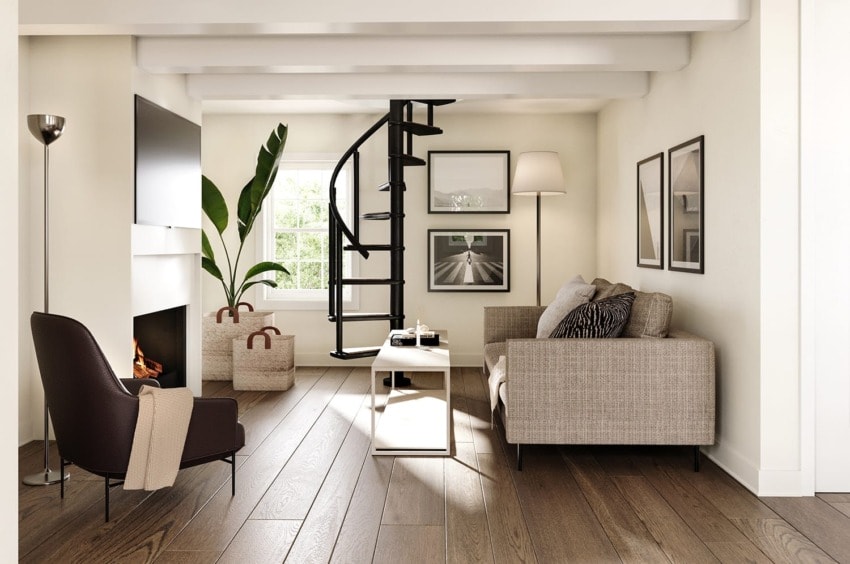 Modern living room with spiral staircase, cozy seating, large windows, and framed wall art.