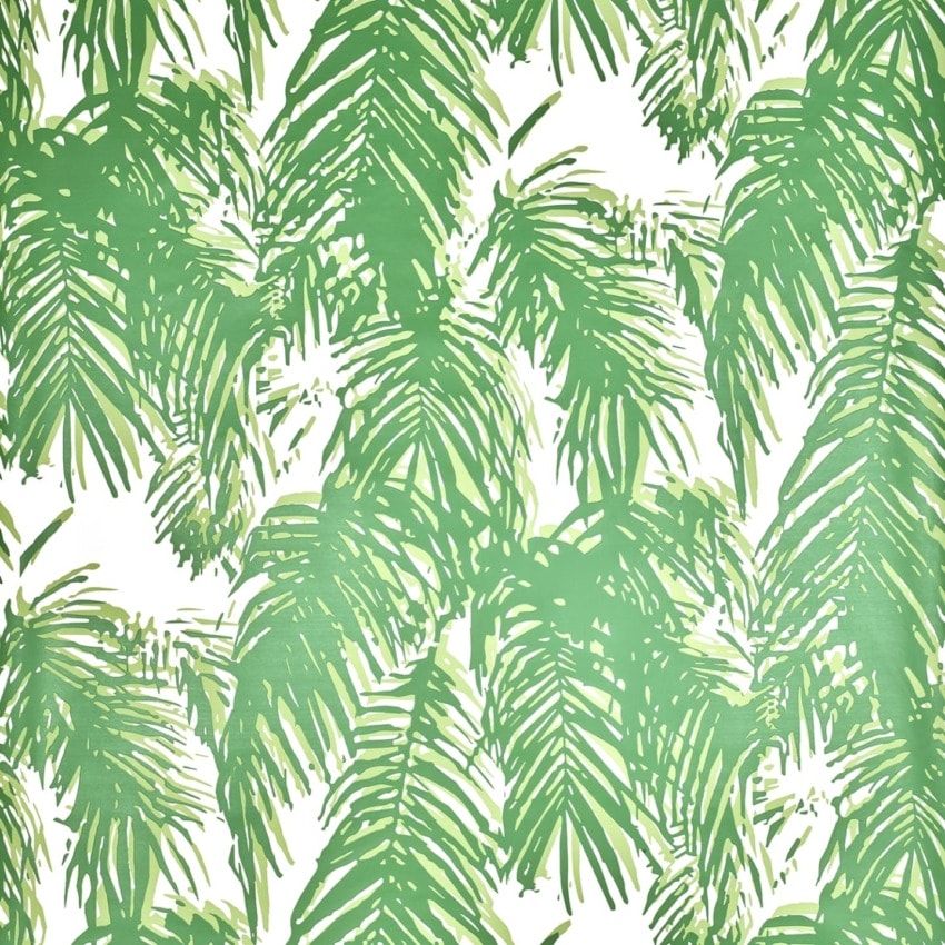 Green palm leaf pattern on a white background, creating a tropical and natural motif for wallpaper or fabric design.