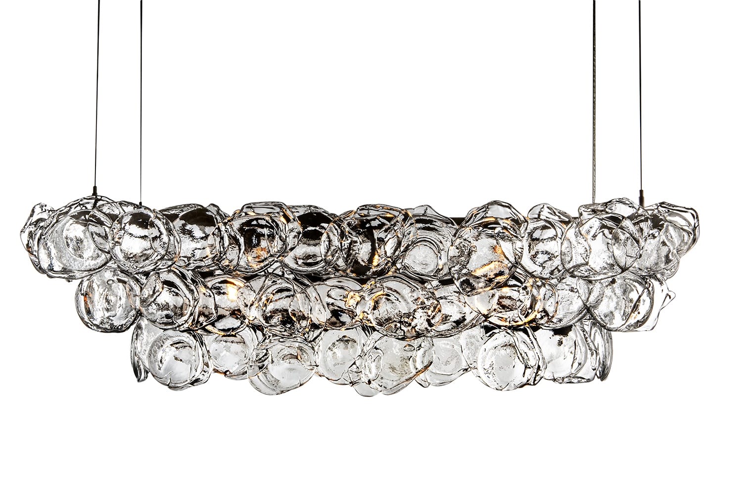 Modern glass chandelier with an artistic cluster design and warm lighting, suspended by thin wires against a white background.