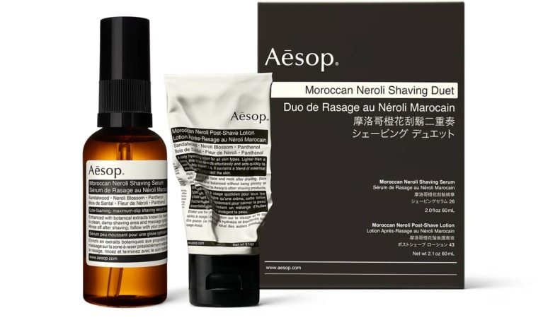 Aesop Moroccan Neroli Shaving Duet packaging with a spray bottle and cream tube displayed in front of a black box.