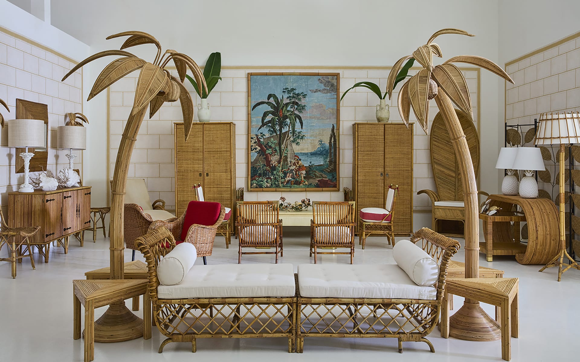 Vintage tropical-themed living room with wicker furniture, palm-shaped decor, and a large painting on the wall.