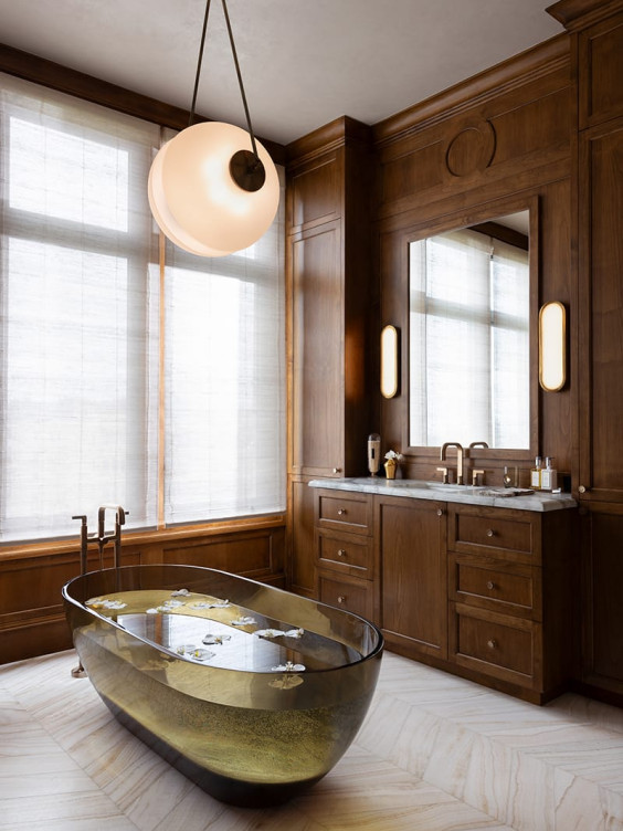 To craft the dreamy main bath, designer Lauren Berry chose beautiful lighting from Apparatus and gorgeous materials from Artistic Tile, Da Vinci Marble, and Anaya Stone and Tile.