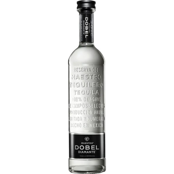 Tall bottle of Maestro Dobel Diamante Tequila with transparent glass showing engraved details and a black label at the base.